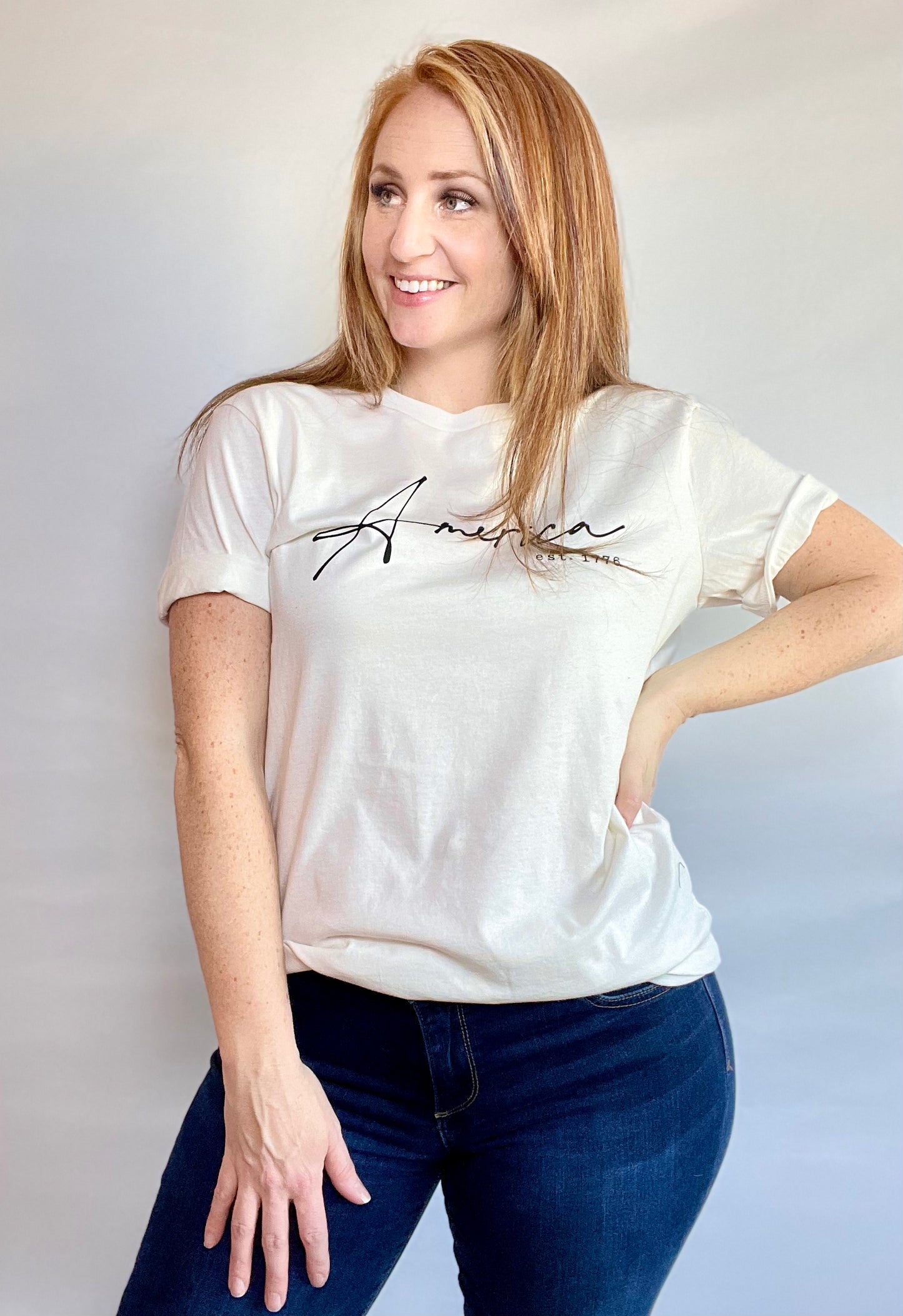 Show your patriotic spirit with our "AMERICA EST. 1776" T-shirt. This hand-screen printed graphic tee proudly displays its message on a high-quality 100% cotton fabric, ensuring both style and comfort.