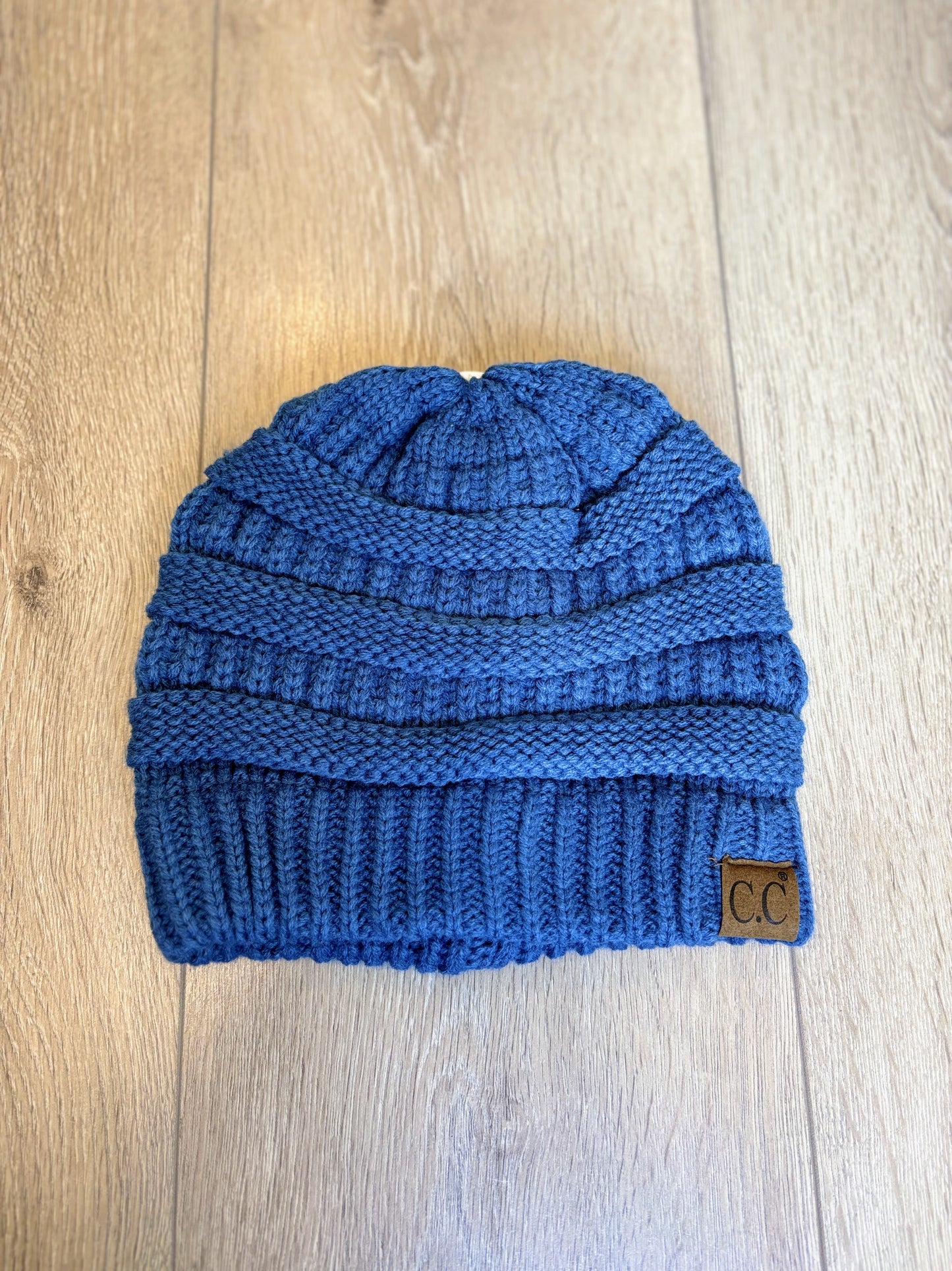 Bright Blue CC knit beanie with a ribbed texture, soft material, and cozy fit, perfect for cold weather