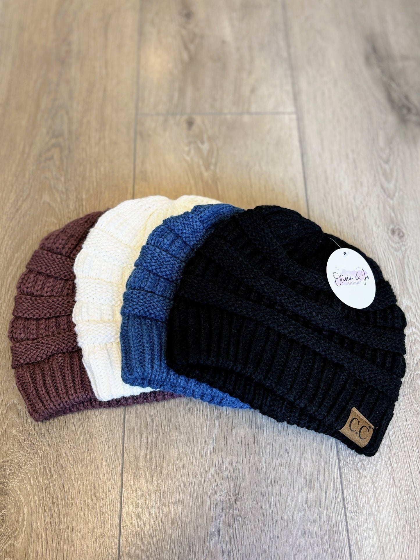 CC knit beanies with a ribbed texture, soft material, and cozy fit, perfect for cold weather