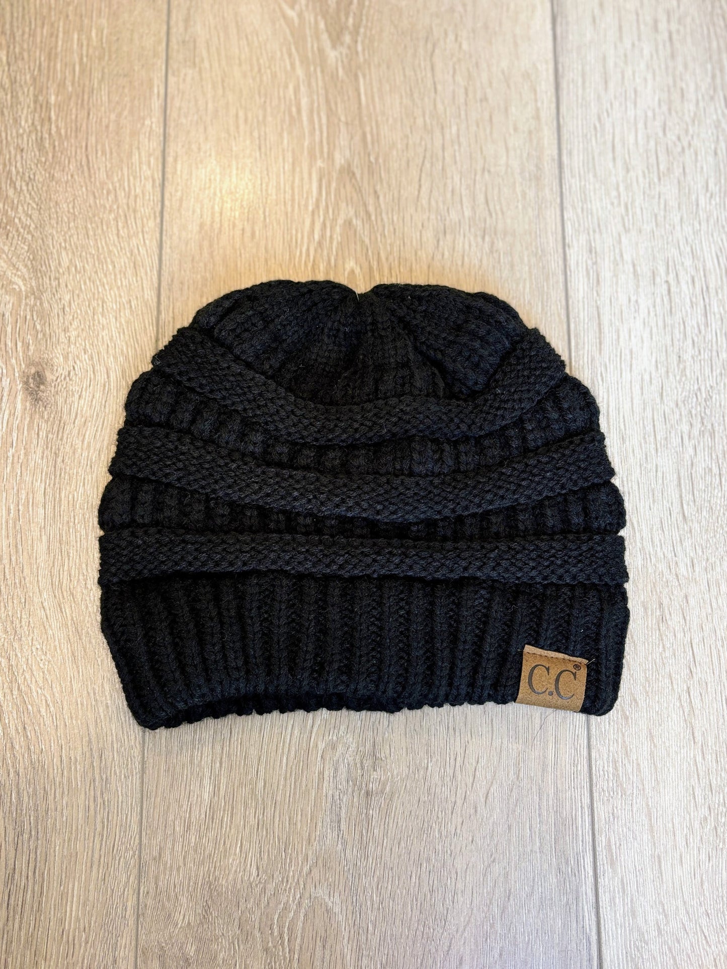 Classic Black CC knit beanie with a ribbed texture, soft material, and cozy fit, perfect for cold weather